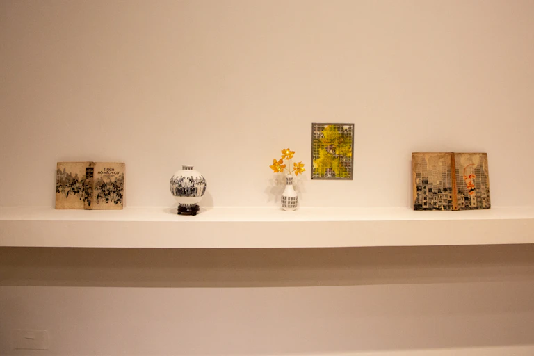 Sculptures on a long wide plinth.