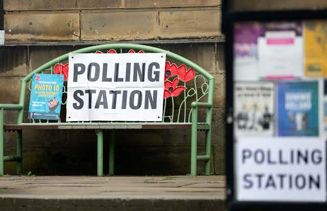 A poster reminding voters to bring photo ID at a polling station in Holmfirth, Britain, 04 May 2023.