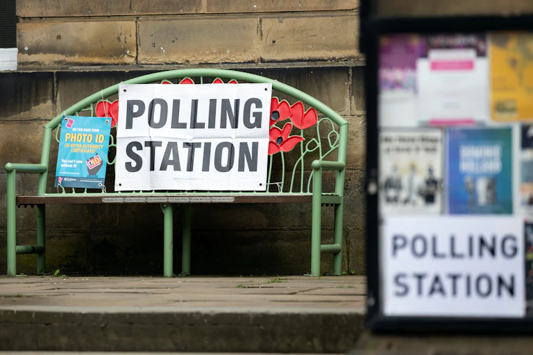 A poster reminding voters to bring photo ID at a polling station in Holmfirth, Britain, 04 May 2023.