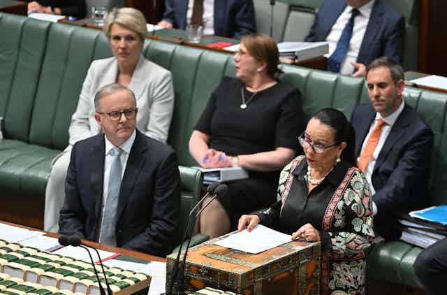 Minister for Indigenous Australians Linda Burney speaks in parliament, standing next to Prime Minister Anthony Albanese.