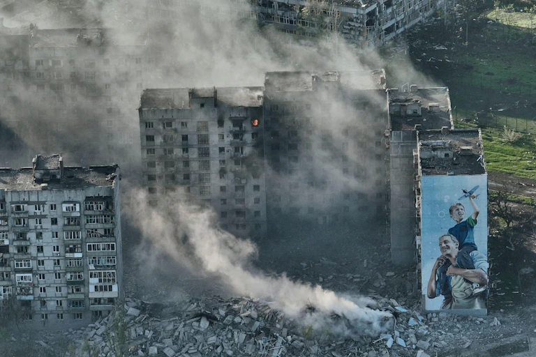 Burning apaartment blocks in Bakhmut.