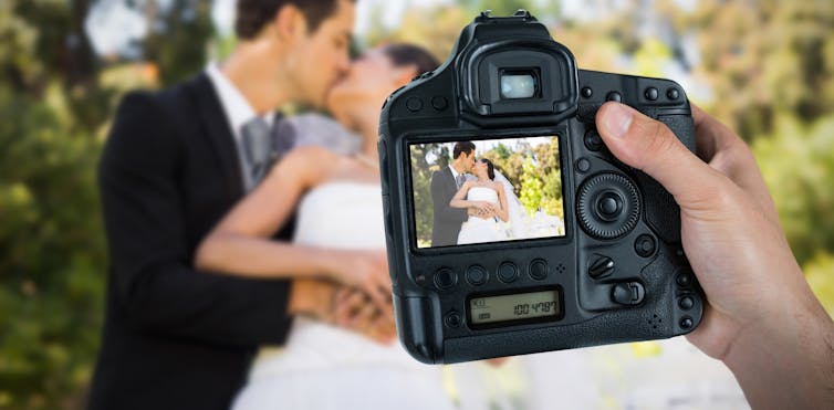 View through camera of couple on wedding day