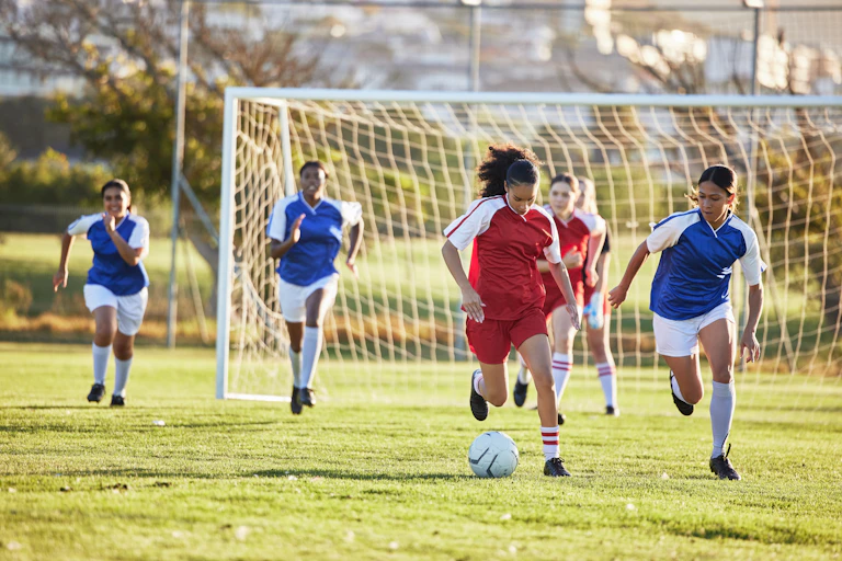 Women playing soccer