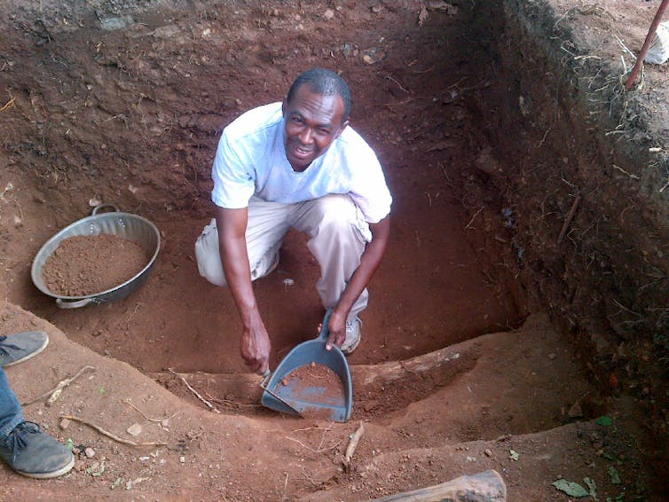 A man holding work tools