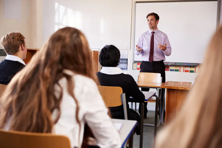 Teacher at front of classroom