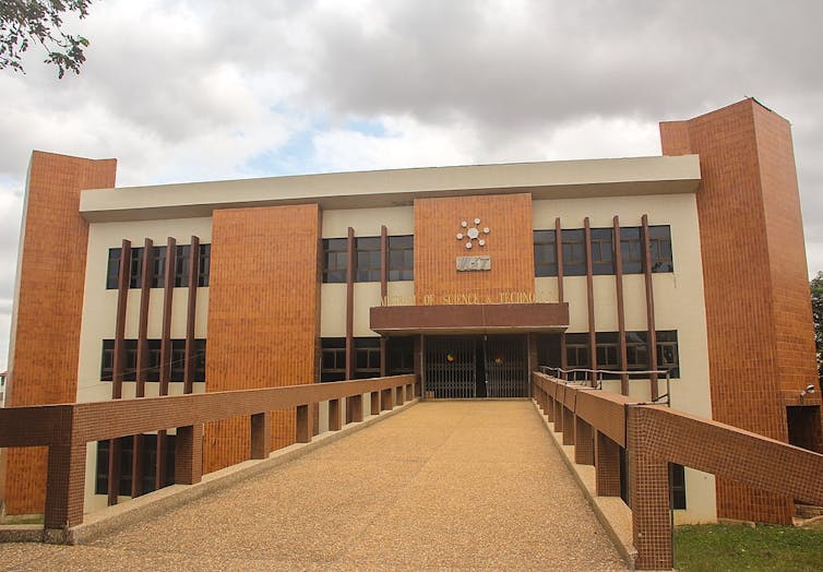 A large building of brick and plaster.