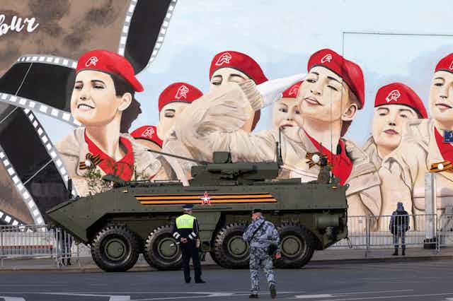 Russian military hardware move along the Garden Ring road against the background of patriotic graffiti heading to Red Square for the Victory Day military parade rehearsal in central Moscow, Russia