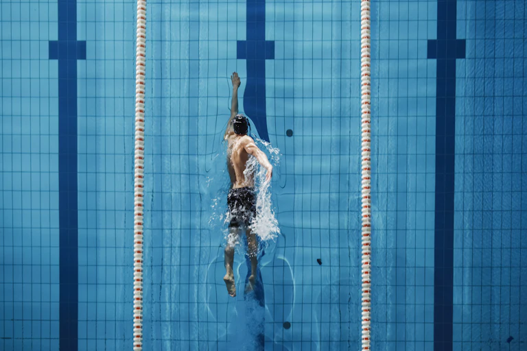 A man swimming in a pool.