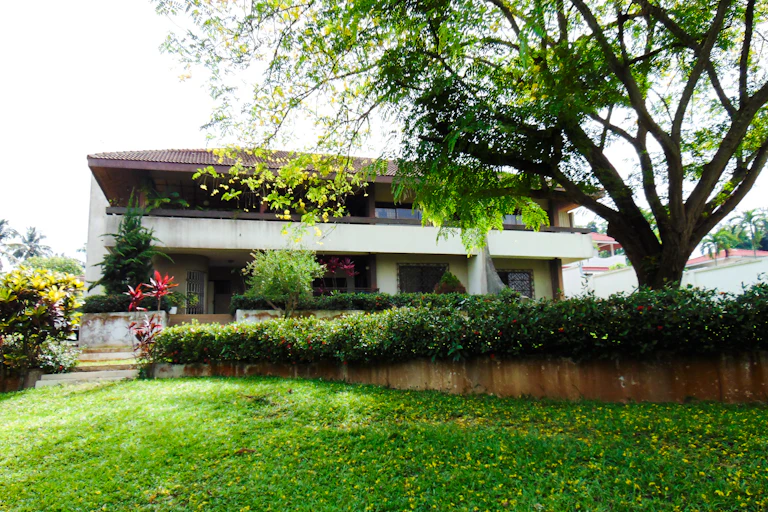 A modernist house seen from the garden.