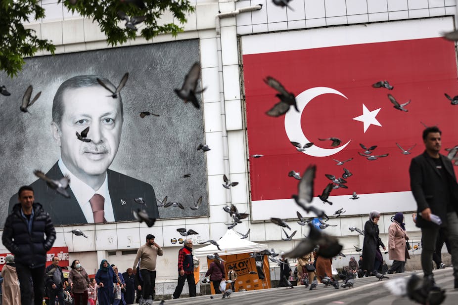 Billboard of Erdogan with birds flying around