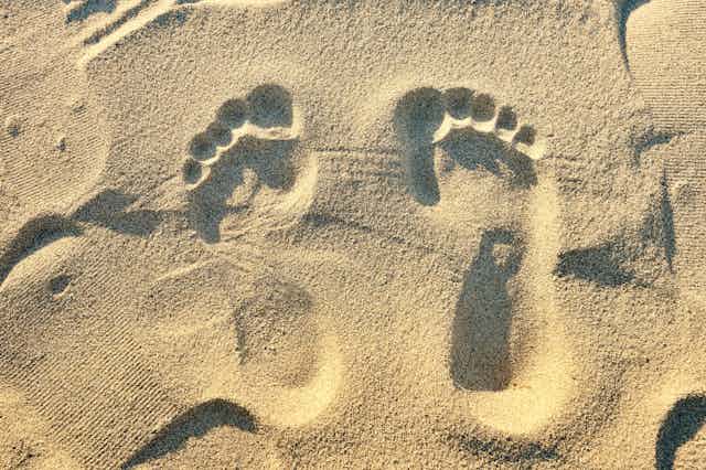 Close-up of footprints in the sand