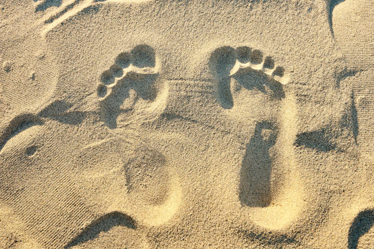 Close-up of footprints in the sand