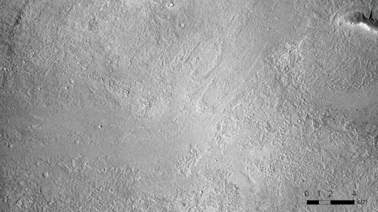 An animation of a grey landscape where a dark splash mark suddenly appears