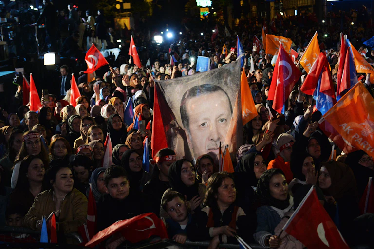 Turkish voters waving flags and posters