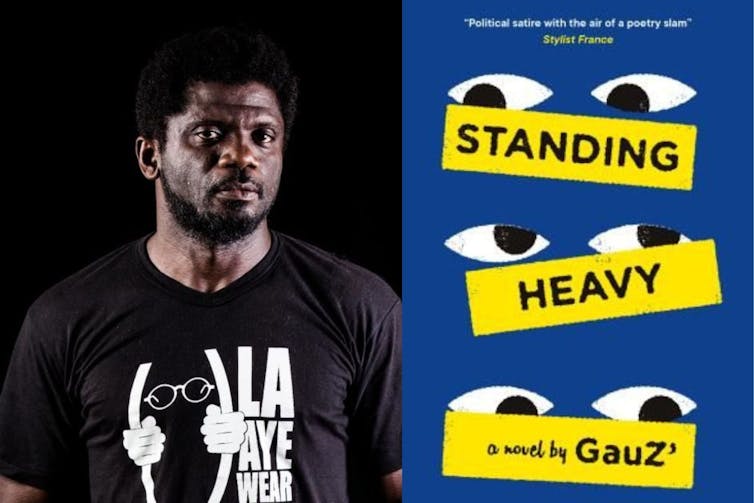Author GauZ' wearing a black t-shirt next to the yellow and black Standing Heavy book jacket.