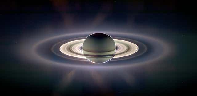 Saturn backlit by the sun.