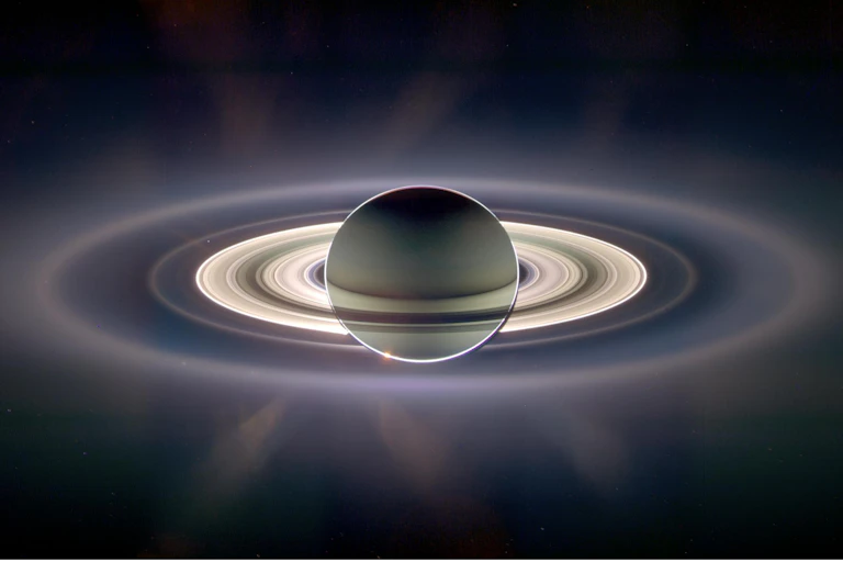 Saturn backlit by the sun.