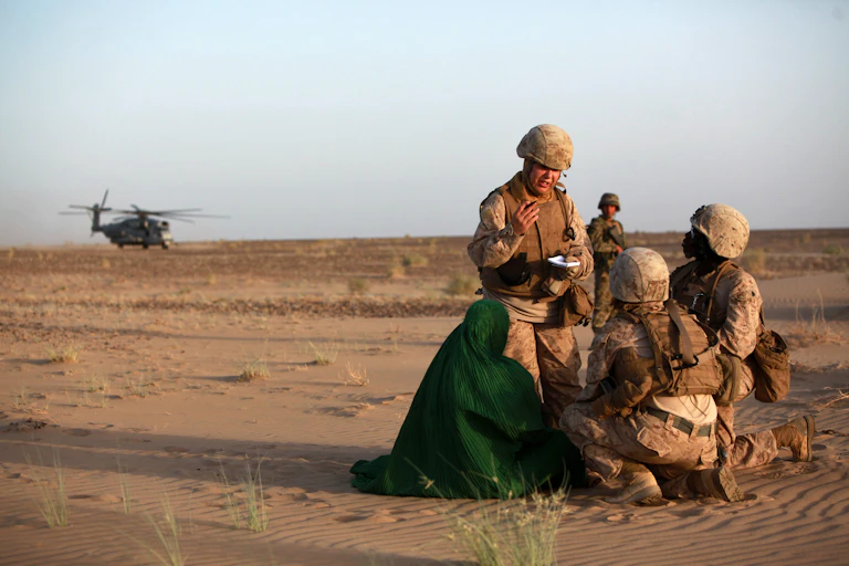 Female soldiers talking to a local woman in Afghanistan