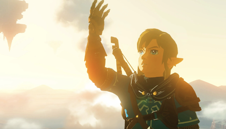 Link reaching out an arm in the sunset.
