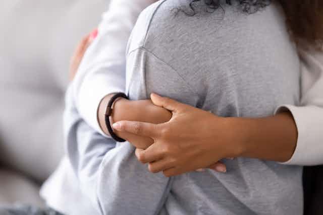First Nations women hugging