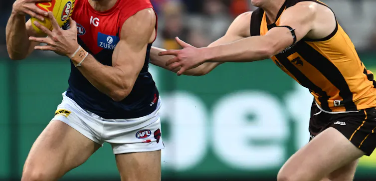 Stadium advertising for betting, shown at an AFL match, helps normalise gambling.