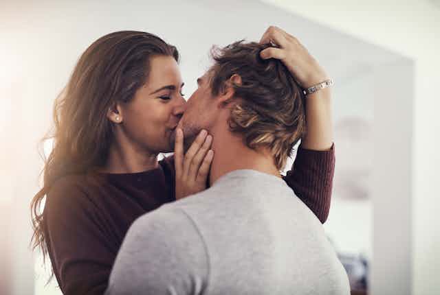 Couple kissing.
