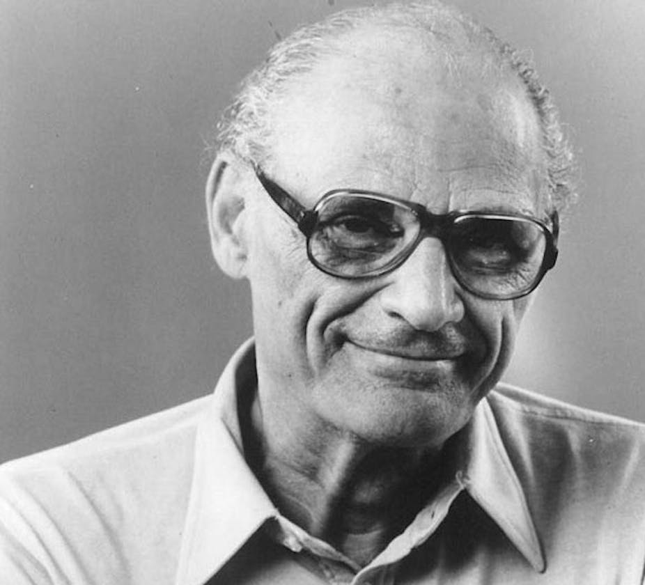 Arthur Miller wearing glasses and a collard shirt in a black and white photograph.