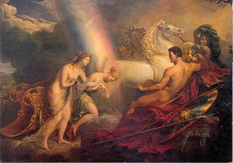 Una mujer inclinada del brazo de otra, de cuya espalda sale un arcoíris, se dirigen a un hombre que las observa.