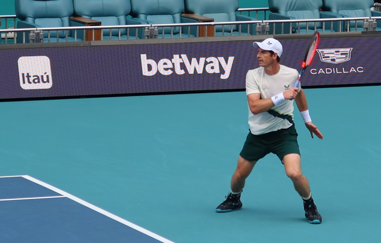 Andy Murray playing on the blue court of the 2023 Miami Open.