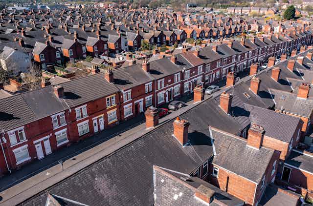 Aerial view of rows of red brick terraced houses in England