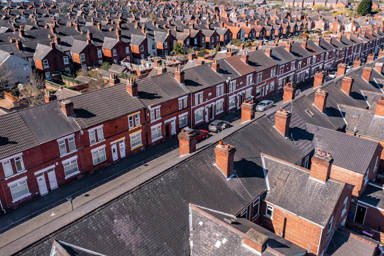 Aerial view of rows of red brick terraced houses in England