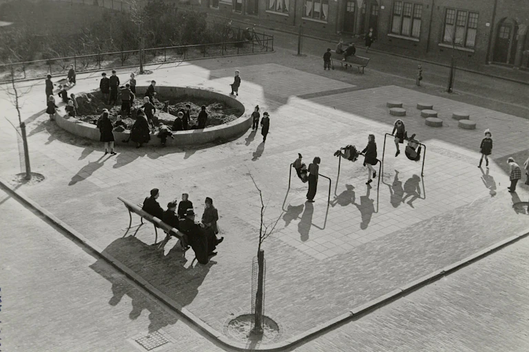 An archival photograph of children playing in a playground.