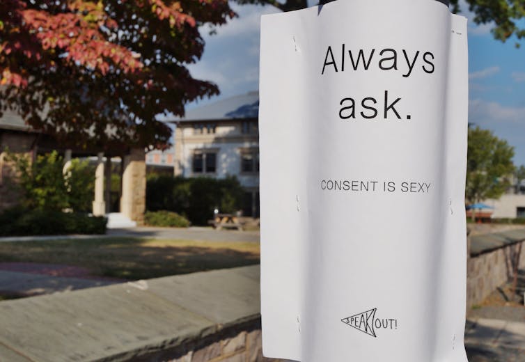 A white poster with the words: always ask, consent is sexy.