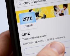 A screen showing the logo for the CRTC.