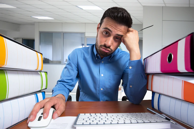 Man looking bored at work.