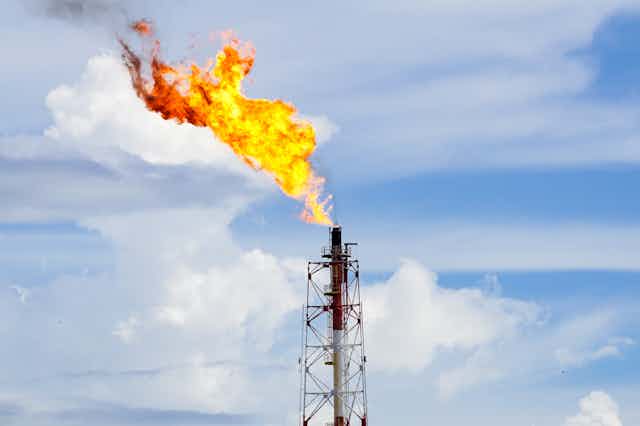 A gas flare at an oil refinery.