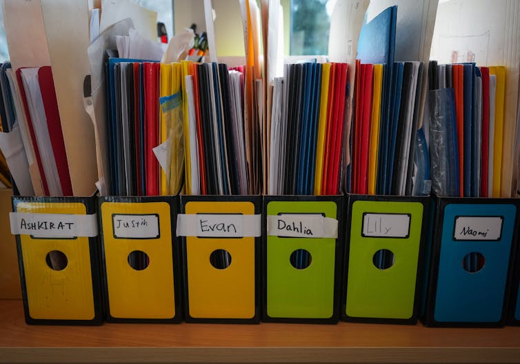 A row of folders seen in a classroom