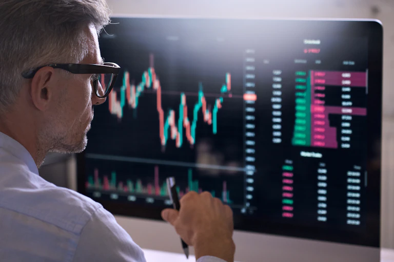 Crypto trader at his trading screen