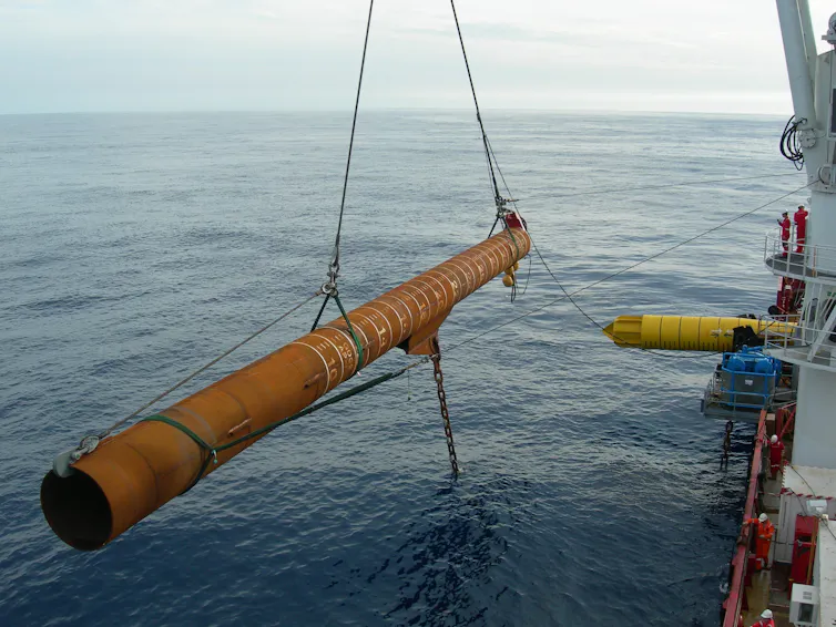 Anchor pile hanging in crane of offshore installation vessel