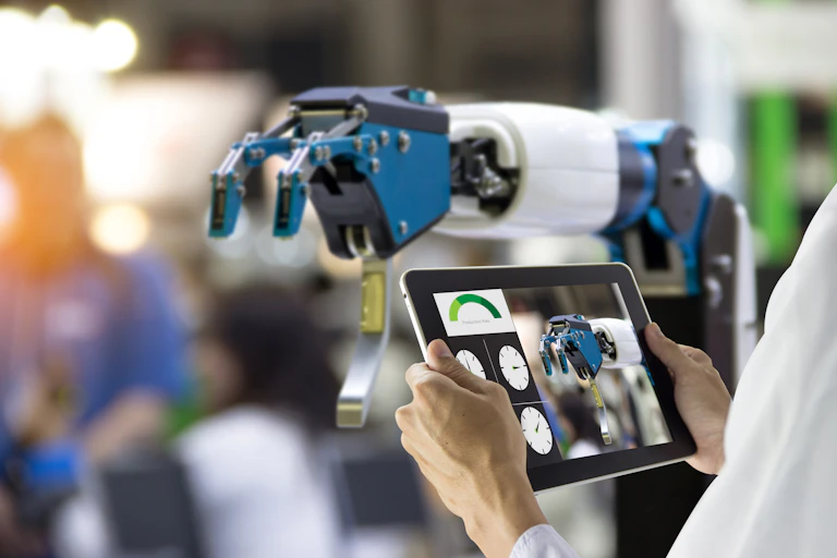 Robot arm being controlled using a tablet computer.