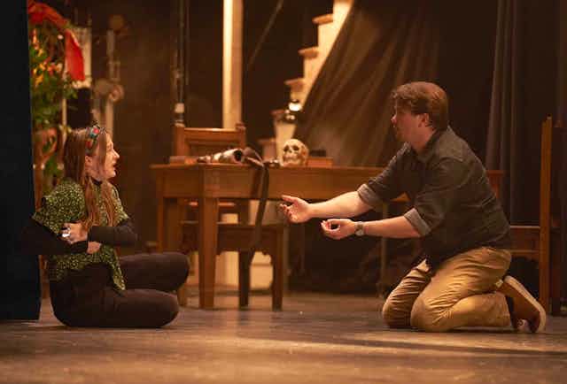 Man tries to comfort crying girl.