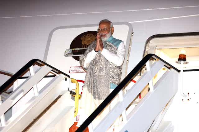 Indian Prime Minister Narendra Modi exiting a plane
