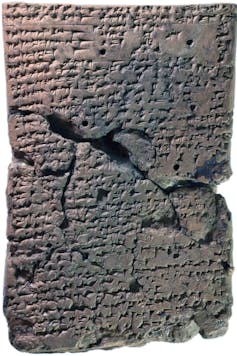 A cuneiform tablet, broken and rejoined.