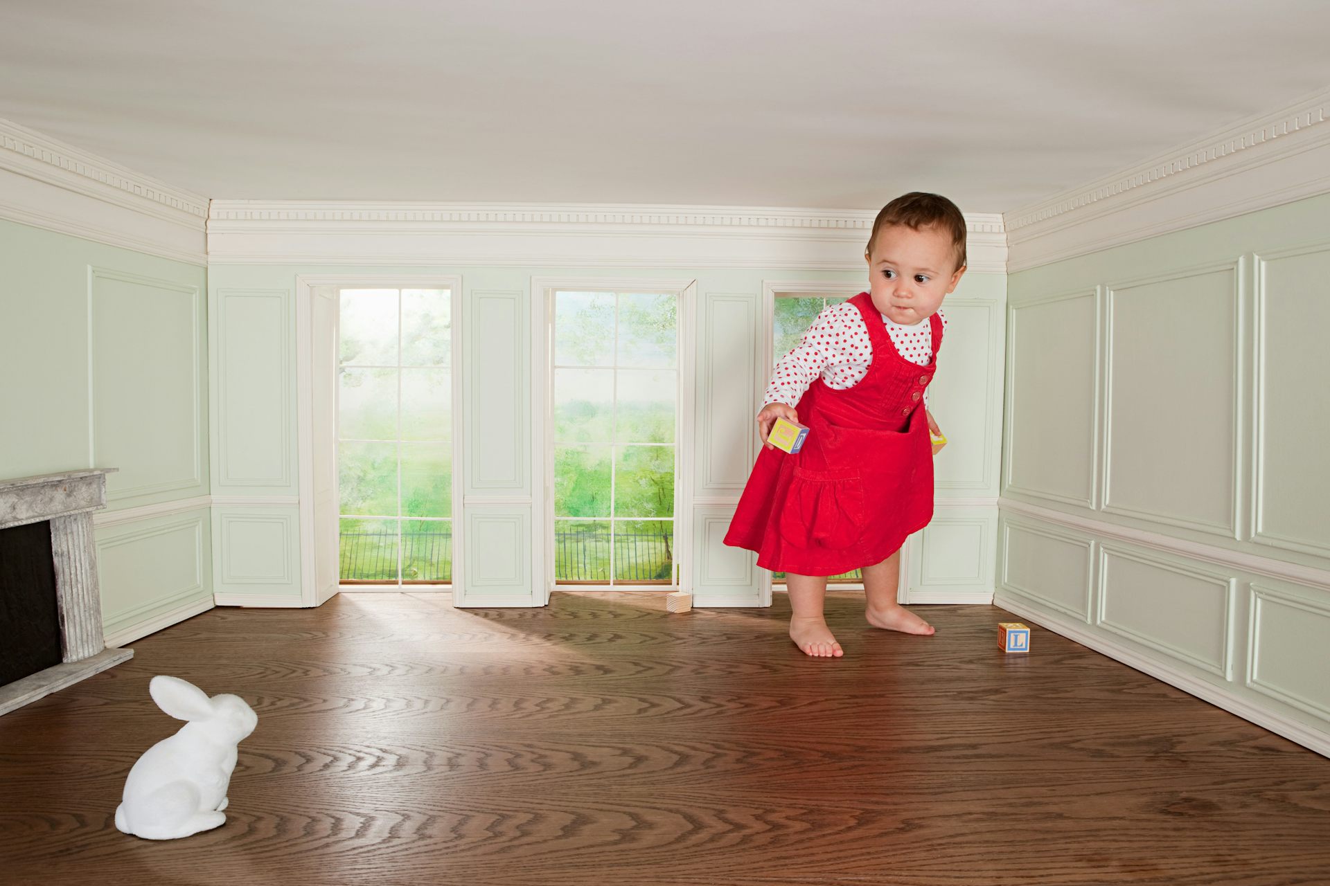 A giant baby. Or a normal-sized baby in a tiny room.
