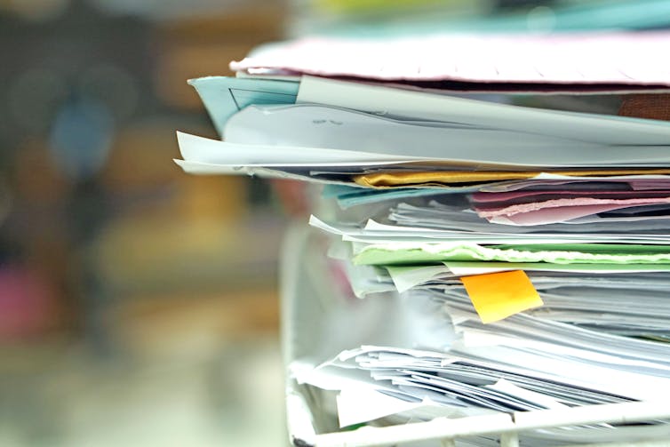 A stack of paperwork in an in-tray