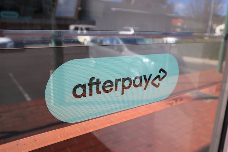 Afterpay sign on shop window.