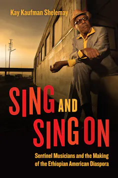 A book cover featuring a photo of a man in a suit and hat looking out from a train.