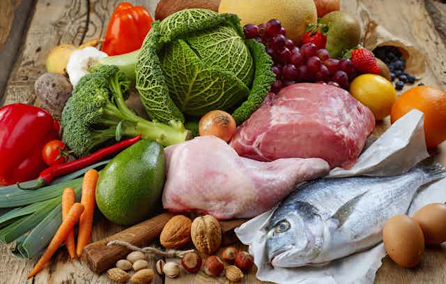 Foods included in the paleo diet including vegetables, buts, chicken, meat, fish, fruit