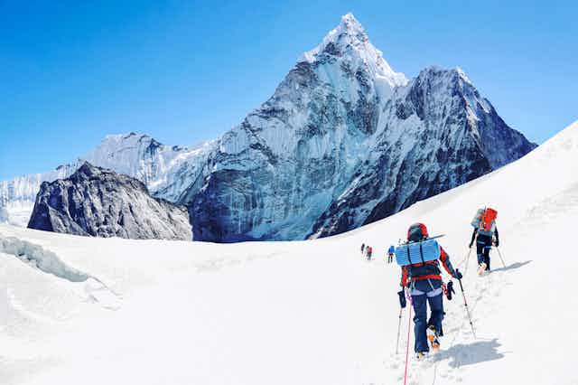 Climbers climbing Mount Everest