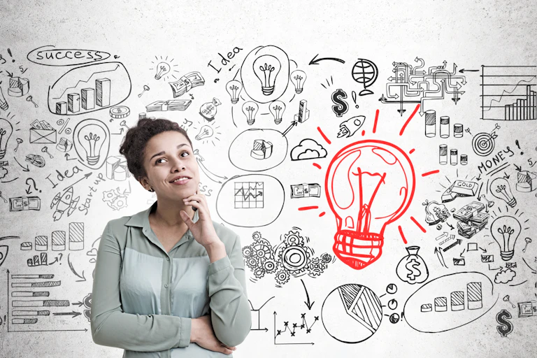 Woman in thought in front of inspiration board.